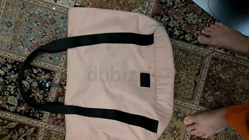 Light pink tote bag with black handles - good condition