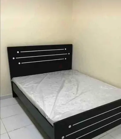 Double bed frame with mattress, black wooden headboard and footboard