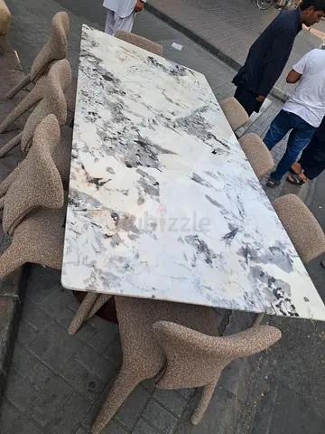 Marble-top dining table with 8 upholstered chairs - good condition