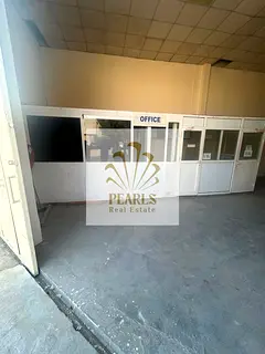 Annual warehouse for rent in Ajman Industrial 1, ready offices, large outside space, total area 2,10