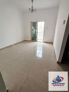 The cheapest one-bedroom apartment in Al Qasimia Al Mahatta, next to Al Mahatta Park, featuring a ki