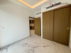 Brand New Corner 1BR with Parking | Lake View | Premium Amenities | Rented at AED 65K