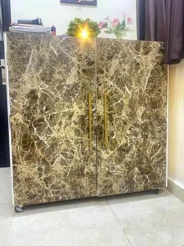 Two-door marble-effect storage cabinet with brass handles