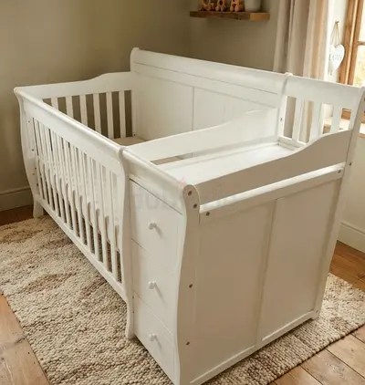 White Baby Crib with Attached Changing Table and Drawers