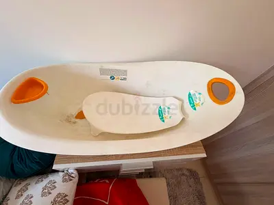 Used baby bath tub with infant support insert