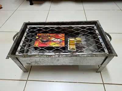 Portable charcoal barbecue grill with 12 skewers (used)