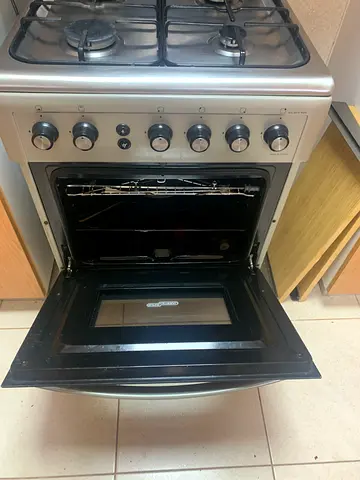 Used freestanding gas oven and hob - stainless steel, good working condition with regulator