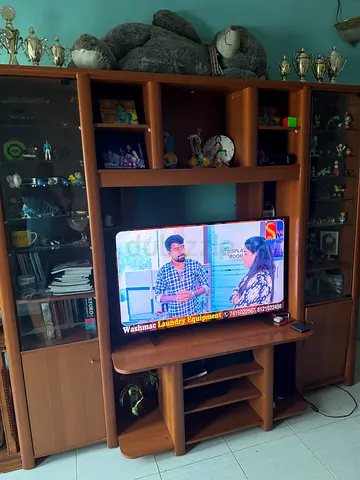 Large wooden entertainment center / TV unit with shelves and glass cabinet