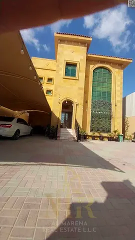 Villa in Al Rawda 2, modern finishing, directly opposite the mosque, including electricity, water, and air conditioning, freehold ownership.