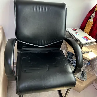 Black faux leather office visitor chair - sturdy frame, used