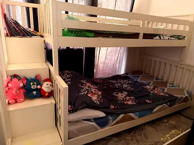White wooden bunk bed with stairs and storage - good condition