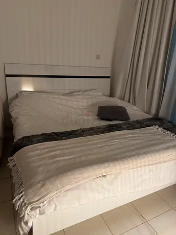 King bed frame with mattress and linens — good condition just 9 month has been used