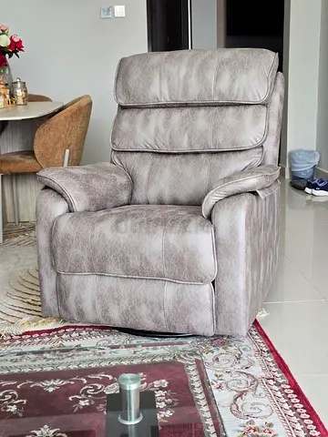 Comfortable single leather recliner chair - Revolving and rocking too.