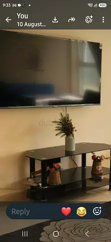 55-inch LED Smart TV mounted with stand (used, good condition)