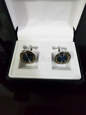 Pair of round navy and gold men's cufflinks in presentation box