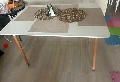 White Scandinavian-style Dining Table with Wooden Legs - Good Condition
