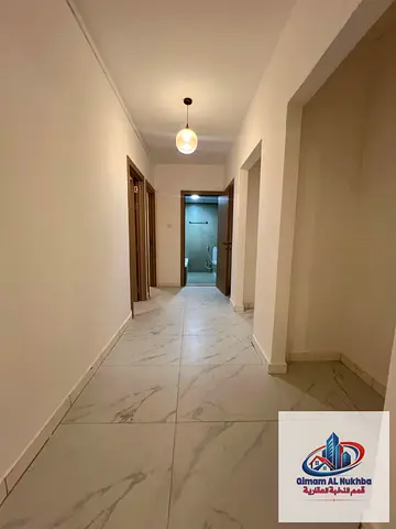 Luxury 3-bedroom apartment with a spacious living room and balcony offering an open view in Al Maja