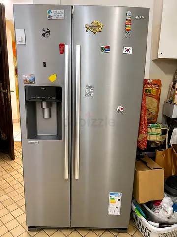 LG Side-by-Side Refrigerator with Water Dispenser — Stainless Steel, Good Condition