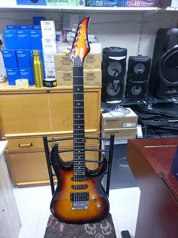 Brand new electric guitar - sunburst double-cut, tremolo, 6-string with cable