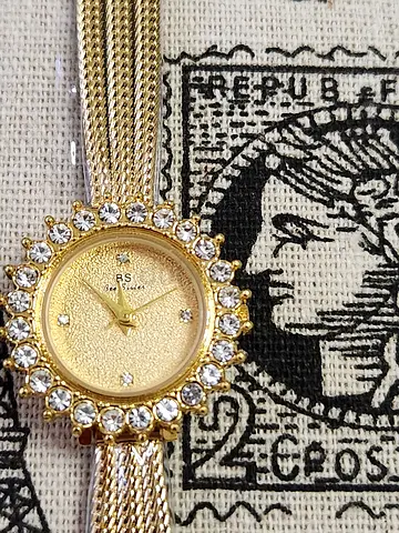Gold-tone women's bracelet watch with crystal bezel - working