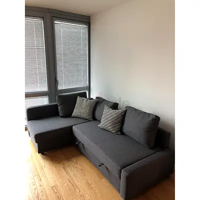 Grey L-Shaped Sofa Bed with Pull-Out Section