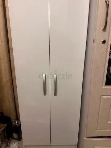 White tall storage wardrobe with two doors — good condition