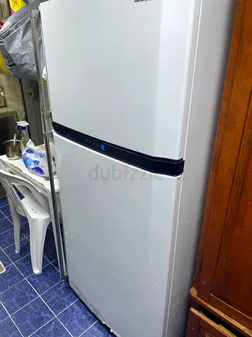 Standing double-door refrigerator in good working condition