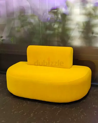 Compact modern yellow upholstered two-seater sofa