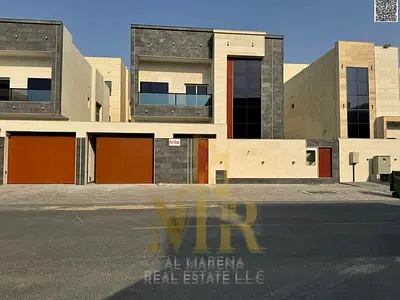 Luxury villa for sale in Al Amrah area - Ajman | Central air conditioning, modern design and luxurious specifications. Seize the opportunity to own a