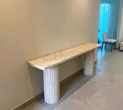 Elegant Cream stone console table with fluted column legs