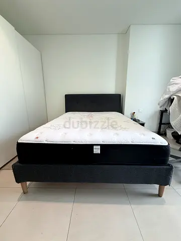 Queen size mattress with upholstered bed base and headboard - good condition