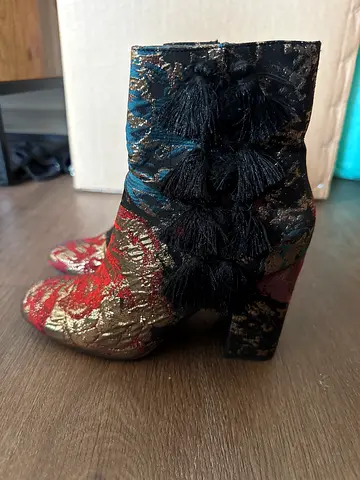 Pair of embroidered brocade women's ankle boots with tassel detail