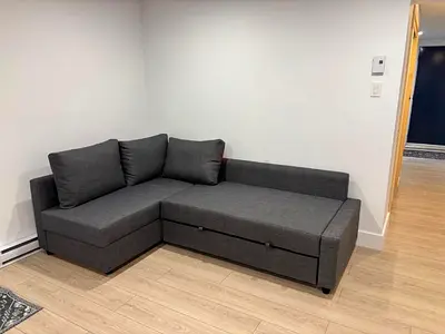 Gray L-shaped Sofa bed with Storage — Good Condition