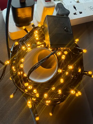 Warm yellow LED fairy string lights with controller
