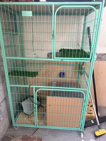 Large metal cat cage with perches and trays