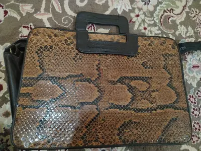 Brown snakeskin-patterned women's handbag with top handles
