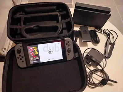 Nintendo Switch (Grey Joy‑Con) with Dock, Pro Controller Grip and Carry Case - Good Condition