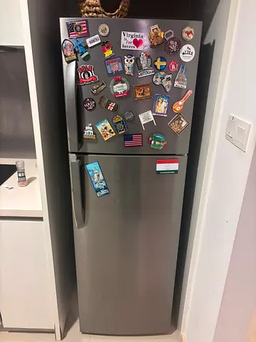 Used single-door refrigerator with freezer compartment - stainless steel finish