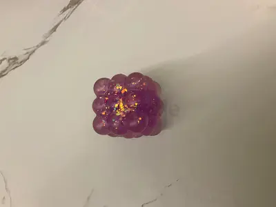 Small purple squishy bubble toy / stress reliever (used)