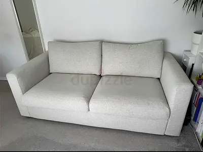 Comfortable light grey 2-seater sofa
