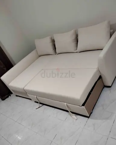 Comfortable Beige L-Shaped Sofa Bed with Pull Out Function