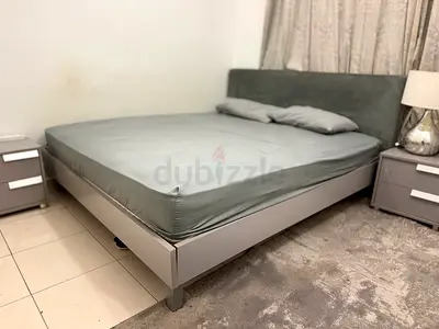 Queen size bed frame with headboard, two bedside tables one dresser and side lamp