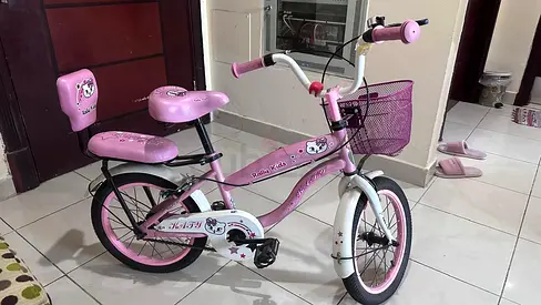 Pink Hello Kitty Kids Bicycle with Training Wheels and Basket in mint condition for sale
