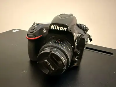 Nikon D810 DSLR with 50mm f/1.8 lens battery grip