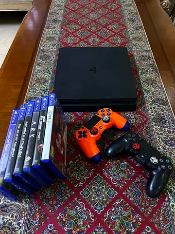 PlayStation 4 Slim with 2 Controllers and 6 Games - Excellent Condition