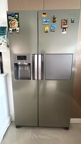 Samsung side by side fridge and freezer new model slightly used with mini baar