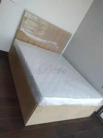 Queen size upholstered bed with mattress