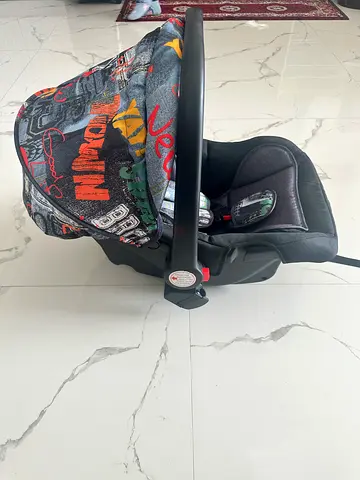 Infant car seat carrier with removable cover - NEW condition