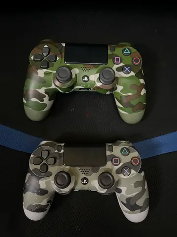 Pair of Camouflage DualShock 4 Controllers (PS4) - Good Working Condition