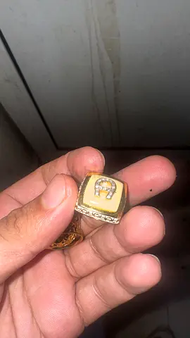 Gold-tone men's signet ring with inset stones
